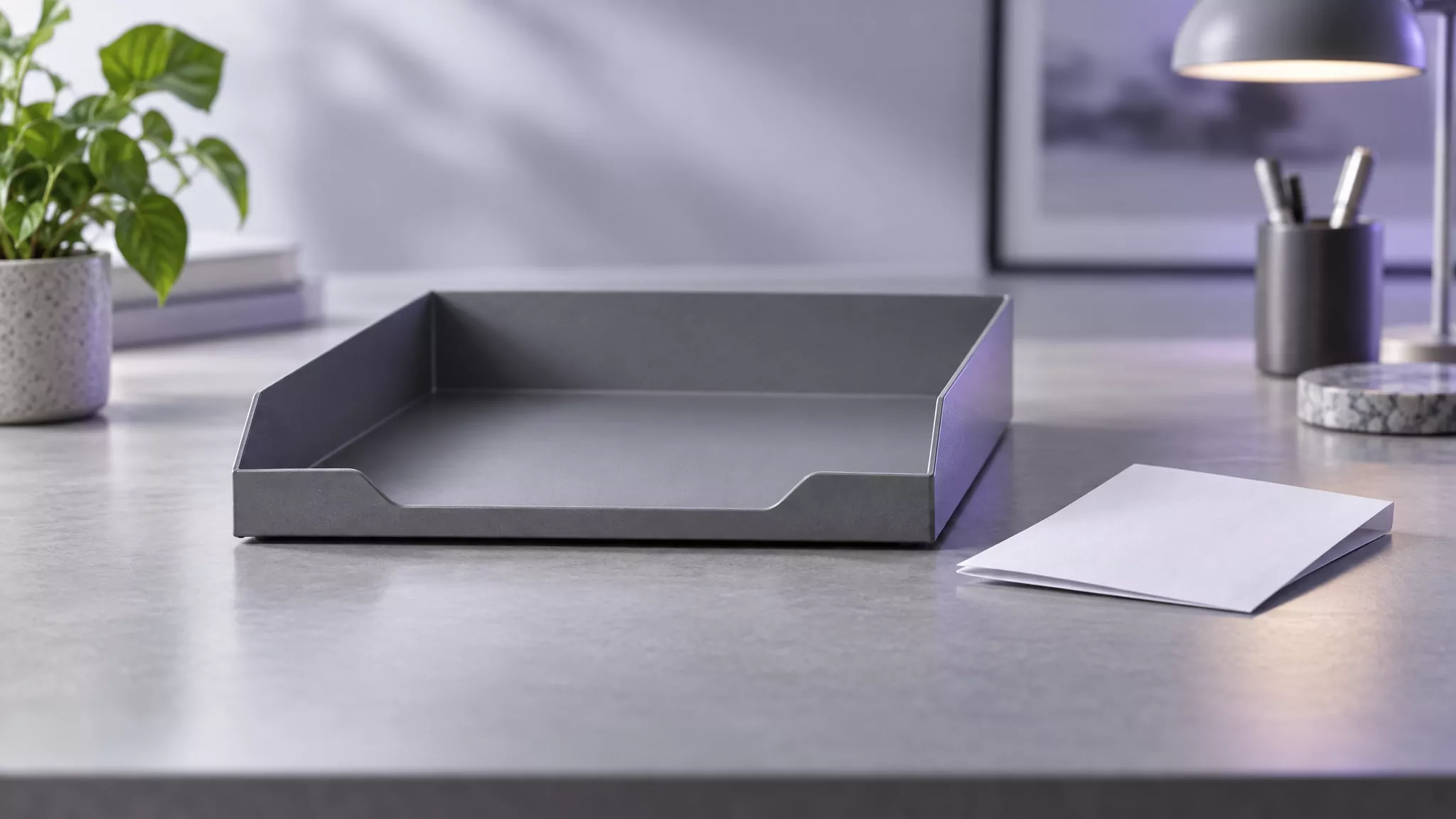 Empty grey desk tray on a clean desk, standing for Google Drive leftovers cleared from the Library folder