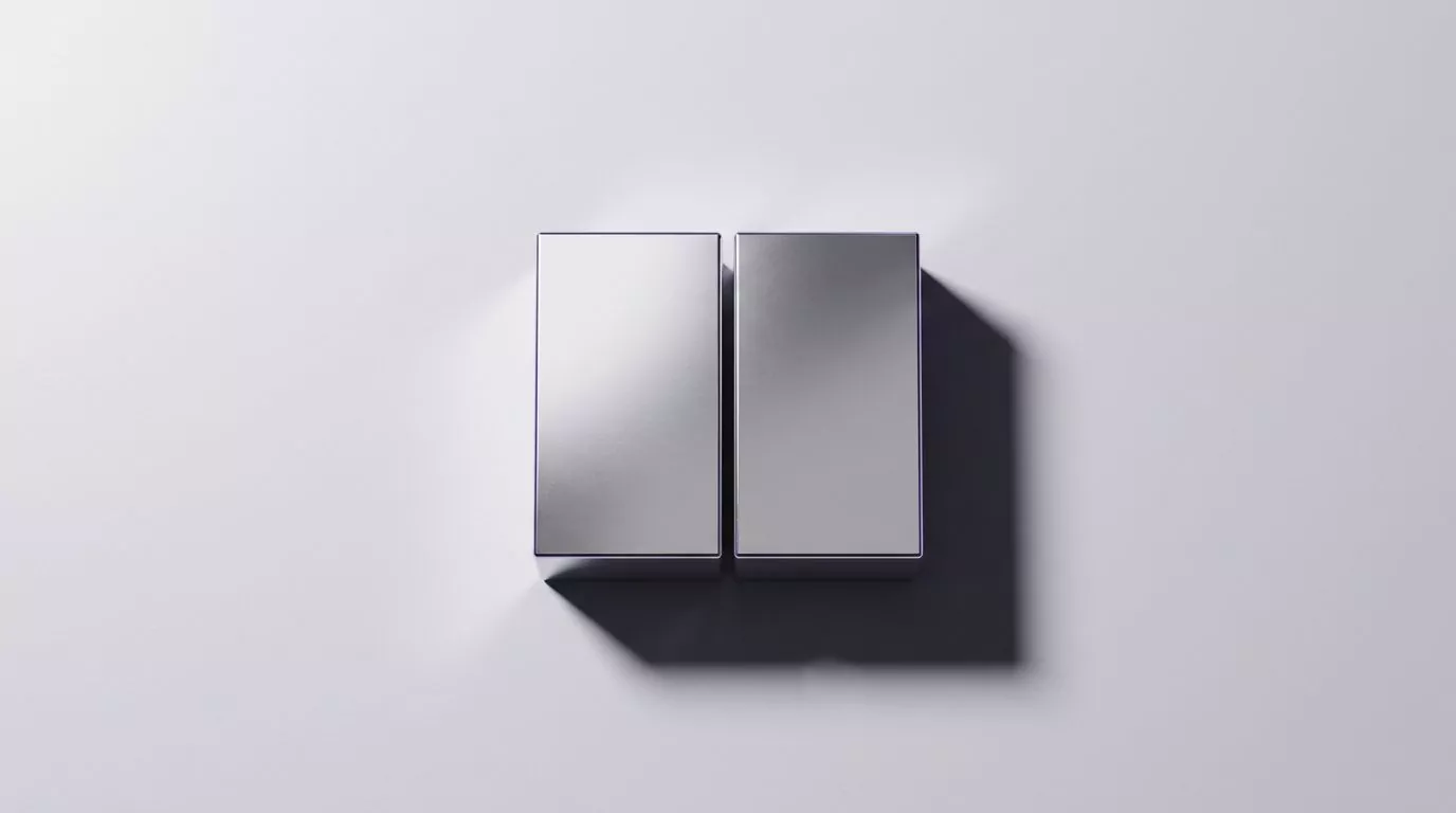 Two identical metal blocks casting one merged shadow, showing two files that share the same storage