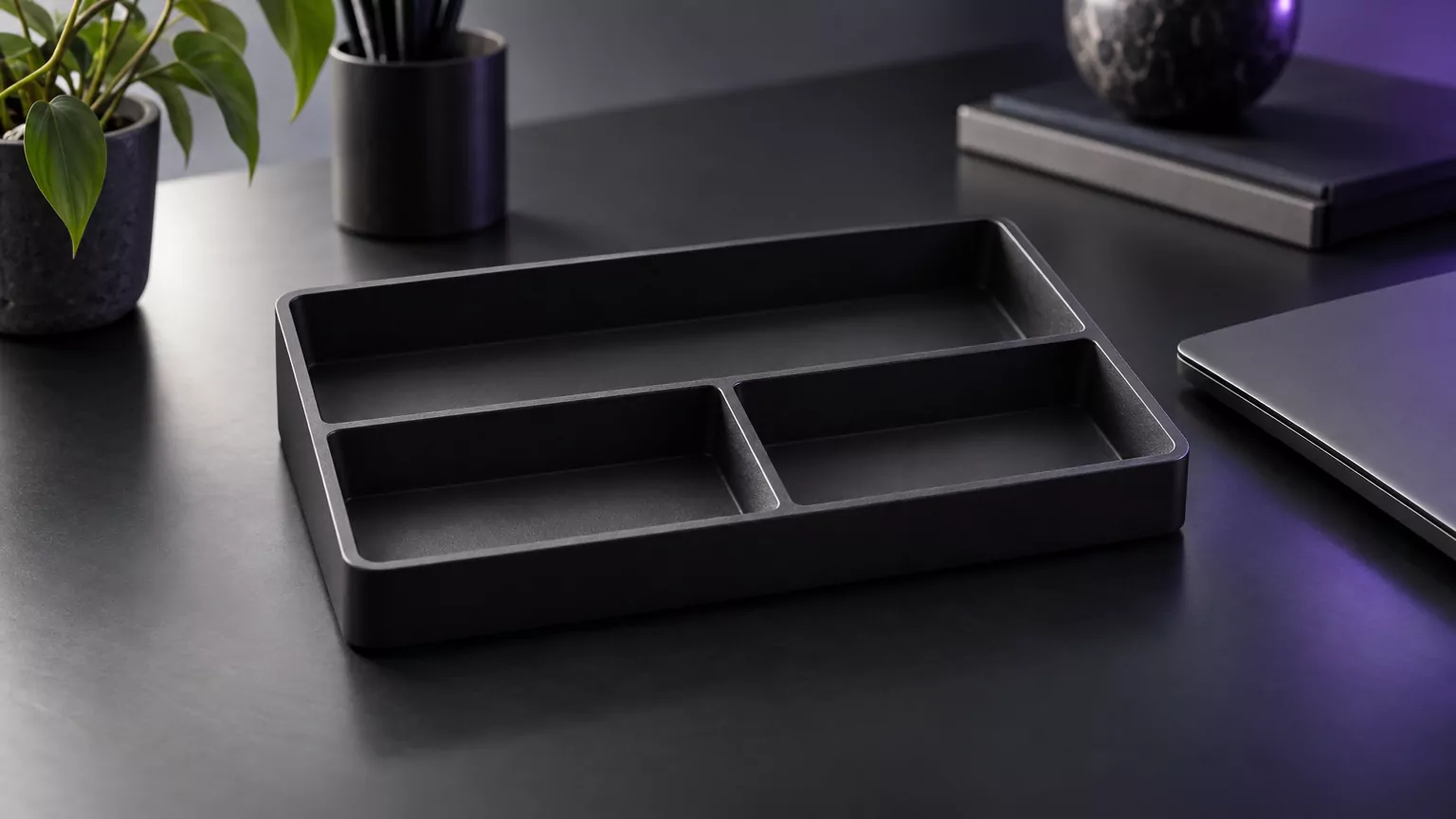 Empty black desk tray standing in for cleared Office containers after you uninstall Office on Mac