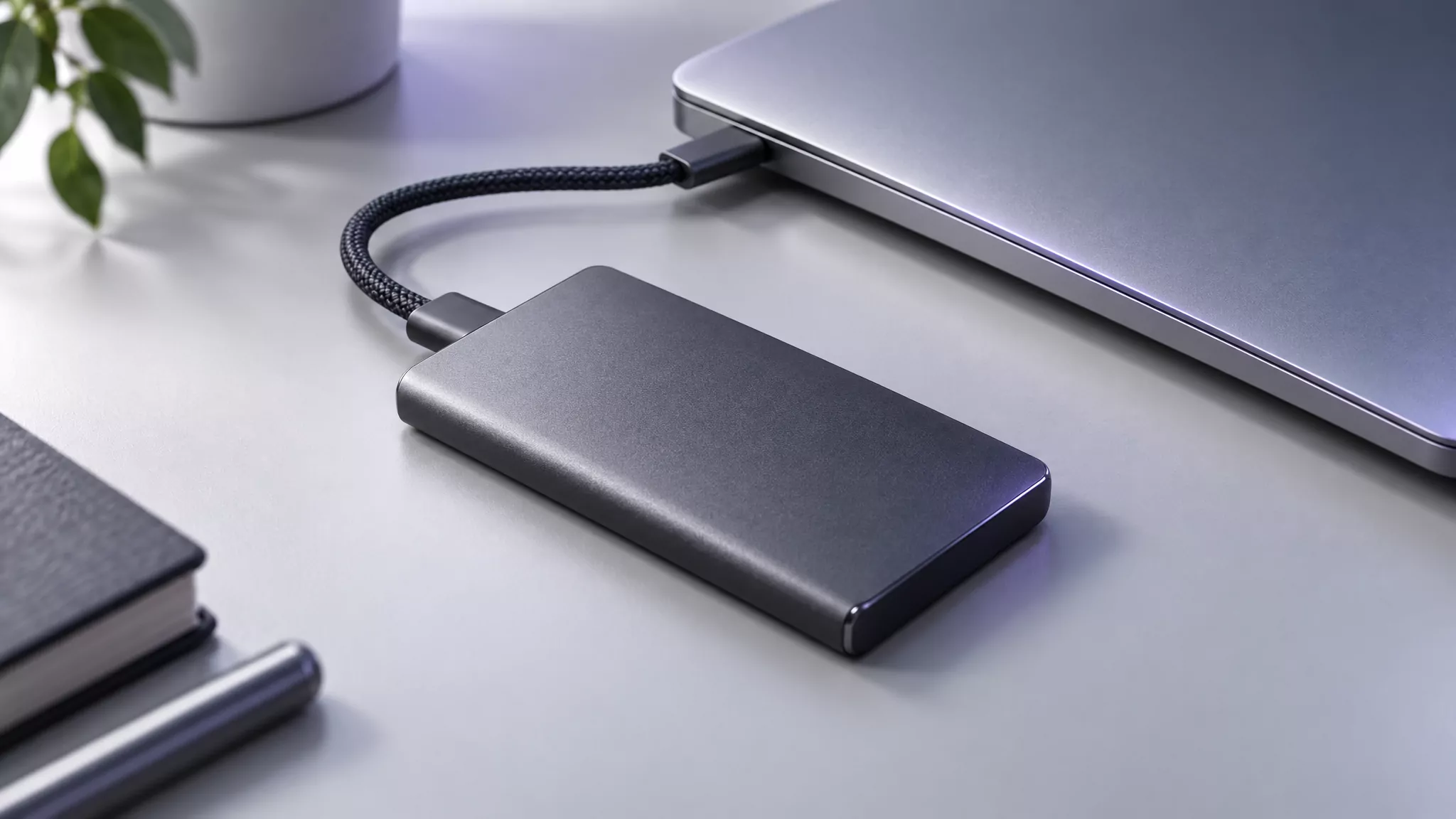 External SSD connected to a Mac laptop, standing in for a Steam library on another drive left after you uninstall Steam